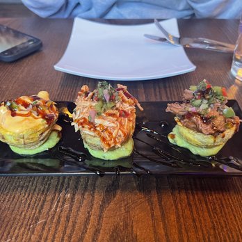 Bocao Sushi - three sushi rolls on a black plate - Sushi Bars Near Me - Charlotte, North Carolina Bocao Sushi - three sushi rolls on a black plate - Sushi Bars Near Me - Charlotte, North Carolina