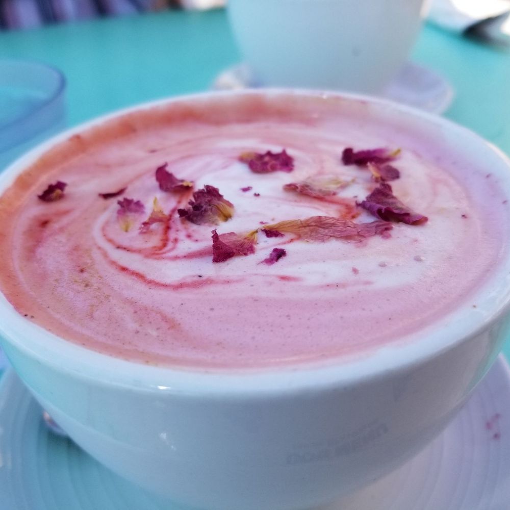 Naked Cafe - a cup of hot chocolate with rose petals on top - Breakfast & Brunch Near Me - Encinitas, California Naked Cafe - a cup of hot chocolate with rose petals on top - Breakfast & Brunch Near Me - Encinitas, California