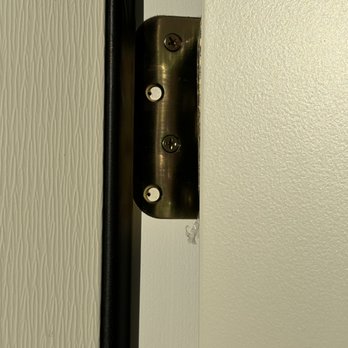 United Home Experts - Example of missing screws on a door hinge. - Roofing Near Me - Ashland, Massachusetts