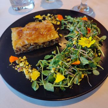 Laney Bistro - SAVORY KALAMATA, PISTACHIO AND HONEY-WINE BAKLAVA - Flower garden salad, wild fennel, orange syrup - Desserts Near Me - Oakland, California