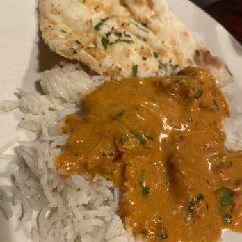 Kolam - a plate of food with rice and bread - Indian Near Me - Newtown, Connecticut Kolam - a plate of food with rice and bread - Indian Near Me - Newtown, Connecticut