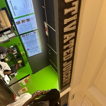 Motivated Juicery - a man standing in front of a juice machine - Acai Bowls Near Me - Dover, Delaware Motivated Juicery - a man standing in front of a juice machine - Acai Bowls Near Me - Dover, Delaware