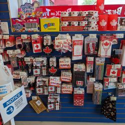 Buck or Two Plus - Canada Day merchandise and a jug of hand sanitizer