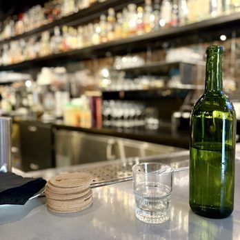 Root & Flower - Water bottle with a glass - Wine Bars Near Me - Vail, Colorado Root & Flower - Water bottle with a glass - Wine Bars Near Me - Vail, Colorado