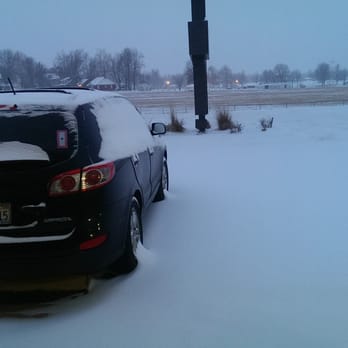 Eldon Inn - Snow filled patking lot which was cleared by noon. - Hotels Near Me - Eldon, Missouri