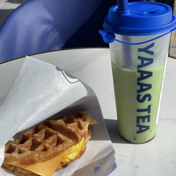 Yaaas Tea - The mini chef's kiss ... sweet crouffle with turkey egg and cheese and pesto sauce , washed down with a strawberry matcha - Bubble Tea Near Me - Westbury, New York