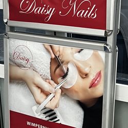 Daisy Nails - A misleading sign that suggests you will enjoy the service.
