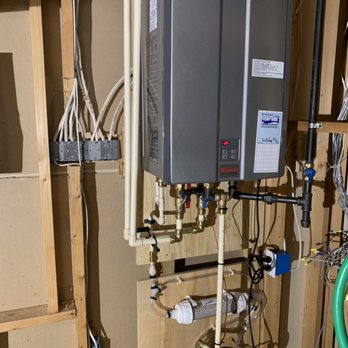 Ben's Plumbing - New tankless water heater with a condensate discharge pump and filter. - Plumbing Near Me - Silver Spring, Maryland