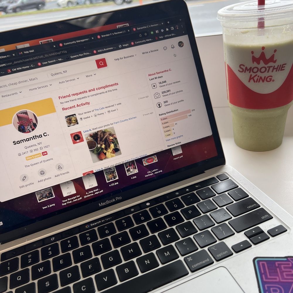 a smoothie and a laptop on a table a smoothie and a laptop on a table