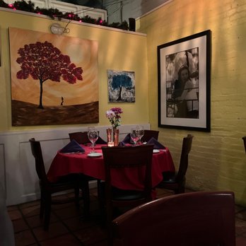 Bay Street Bistro - a woman sitting at a table - New American Near Me - Lakeland, Florida Bay Street Bistro - a woman sitting at a table - New American Near Me - Lakeland, Florida
