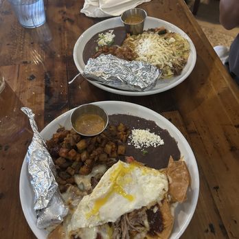 Eldorado Cafe - Chilaquiles Rojas (front), Nomad Plate (back) - Mexican Near Me - Austin, Texas Eldorado Cafe - Chilaquiles Rojas (front), Nomad Plate (back) - Mexican Near Me - Austin, Texas