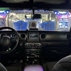 Big Peach Car Wash - Car going through car wash