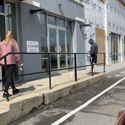 a man and a woman walking out of a starbucks coffee shop a man and a woman walking out of a starbucks coffee shop