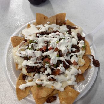Viva Mexico Taqueria - Totopos Preparados with Adobada (Marinated Pork). The Totopos (nacho chips) are very thick and get soggy! - Food Trucks Near Me - Summerfield, Florida Viva Mexico Taqueria - Totopos Preparados with Adobada (Marinated Pork). The Totopos (nacho chips) are very thick and get soggy! - Food Trucks Near Me - Summerfield, Florida