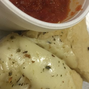 J. Bella's Pizzeria - a bowl of sauce and a piece of pizza - Pizza Near Me - Paducah, Kentucky J. Bella's Pizzeria - a bowl of sauce and a piece of pizza - Pizza Near Me - Paducah, Kentucky