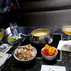 Photo of The Melting Pot - Sacramento, CA, United States. The first course: cheddar bacon fondue with bread, green apple, and Vege dippers (peppers, tomatoes)
