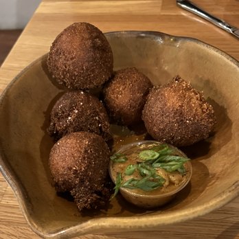 Flying Pig Pub & Kitchen - Hushpuppies with a buttery sauce... delicious - Pubs Near Me - Oceanside, California Flying Pig Pub & Kitchen - Hushpuppies with a buttery sauce... delicious - Pubs Near Me - Oceanside, California