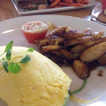 Early Bird - The El guapo omelet. Smoked salmon and waffles with sweet potato fries in the back. - New American Near Me - Fullerton, California