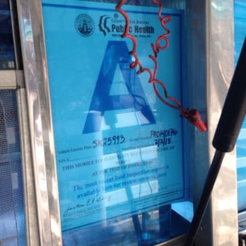 El Grullense - a bus stop with a blue sign - Mexican Near Me - Castaic, California