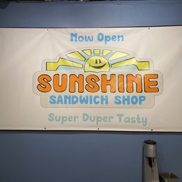 a sign for a sandwich shop a sign for a sandwich shop