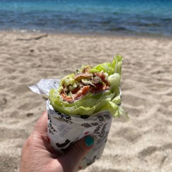 Jimmy John's - a hand holding a sandwich on the beach - Sandwiches Near Me - Carson City, Nevada Jimmy John's - a hand holding a sandwich on the beach - Sandwiches Near Me - Carson City, Nevada