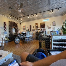 a man sitting in a wine shop