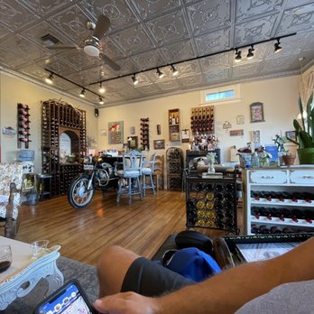 Vino Zona - a man sitting in a wine shop - Wine Tasting Room Near Me - Jerome, Arizona