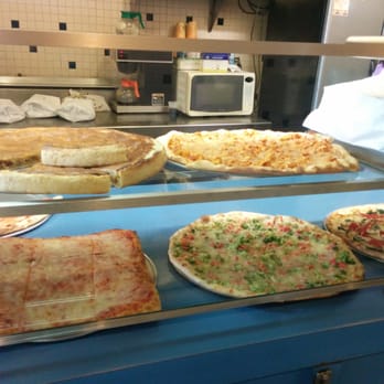 Guido's Pizza - pizzas on display in a restaurant - Pizza Near Me - Camden, New Jersey Guido's Pizza - pizzas on display in a restaurant - Pizza Near Me - Camden, New Jersey