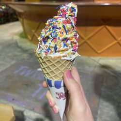 Twistee Treat - Medium soft serve waffle cone with sprinkles.