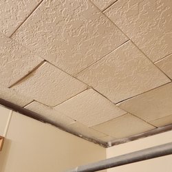 Hendricks Investments - Bathroom ceiling tiles above the shower are coming down