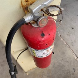 Navy Exchange - Gas pumps with OOC fire extinguishers.