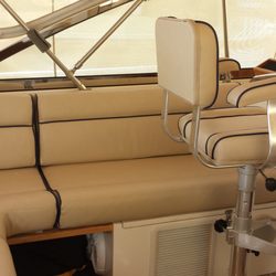 Seams To be Upholstery - cream vinyl with navy blue piping.