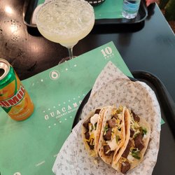 Guacamole - Tacos- Flour tortillas, beef, cheese, cilantro, jalapenos, some sort of yellow cream sauce Sumol- laranja Margaritas original
