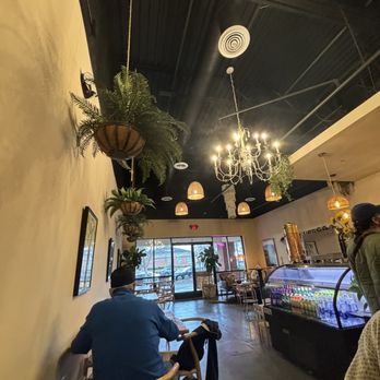 Bolivar Coffee - two people sitting at tables in a coffee shop - Coffee & Tea Near Me - Smyrna, Georgia