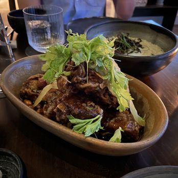 Jun - Pork ribs ($24 for 4 ribs) -- meaty and tender, sweet and quite spicy!  Comes with wet wipes in case you use your hands :) - New American Near Me - Houston, Texas
