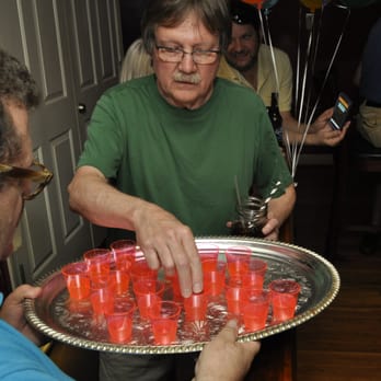 The Pumping Station - a man holding a tray of red candles - Gay Bars Near Me - Memphis, Tennessee The Pumping Station - a man holding a tray of red candles - Gay Bars Near Me - Memphis, Tennessee