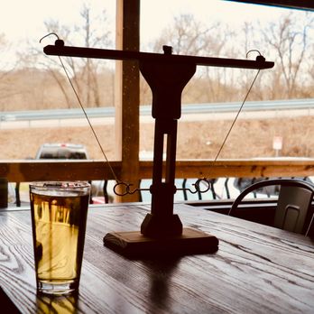 Taps on Downing - a glass of beer on a table - Brewpubs Near Me - Hollister, Missouri Taps on Downing - a glass of beer on a table - Brewpubs Near Me - Hollister, Missouri
