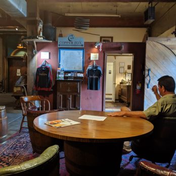 Copper Fox Distillery - Wine barrel chairs and store entrance - Distilleries Near Me - Sperryville, Virginia