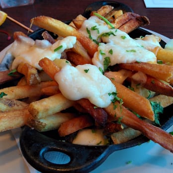 The Lowry - Burnt, thick-cut fries in the poutine. Vegetable stew "gravy" on the side. - Bars Near Me - Minneapolis, Minnesota The Lowry - Burnt, thick-cut fries in the poutine. Vegetable stew "gravy" on the side. - Bars Near Me - Minneapolis, Minnesota