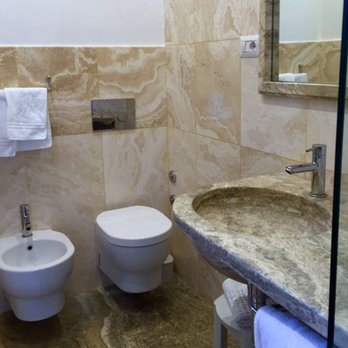 Albergo Chiusarelli - Marble-tiled floors and walls in bathroom. Good sized shower. - Hotels Near Me - Siena, SI Albergo Chiusarelli - Marble-tiled floors and walls in bathroom. Good sized shower. - Hotels Near Me - Siena, SI