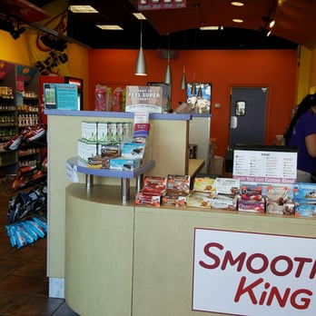 Smoothie King - a woman standing behind the counter - Health Markets Near Me - Katy, Texas