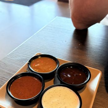 sneakybird - Sauce Flight (3) well he gave us 4 - Chicken Wings Near Me - Surprise, Arizona