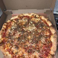 Piccolissimo Italian Grille - Large sausage pizza, delicious!! Their sauce is the best, and their fried calamari is perfect, never overcooked.