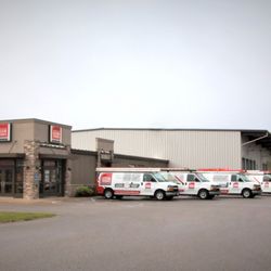 American Door Works - Waite Park Store with fleet of service vehicles.