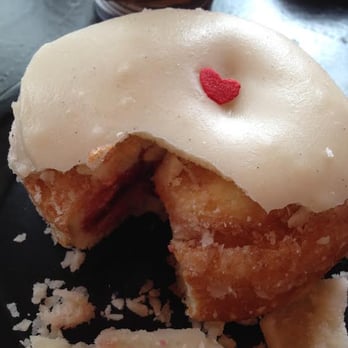 Glam Doll Donuts - Femme Fatale, with a hunk missing because I shared with my pal. Note: the icing chunks all over the plate already. - Donuts Near Me - Minneapolis, Minnesota