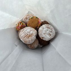 Boston Donuts - Assorted dozen of donut holes. The powder one is bavarian cream. The filling is delicious.