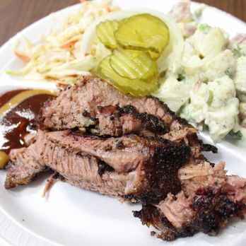Pioneer BBQ - a plate of meat, coleslaw and pickles - Barbeque Near Me - Nixon, Texas