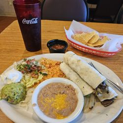 Carrera's Mexican Restaurant - Carne' asada beef tacos with refried beans and rice.