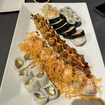 Mizu Sushi - Left to right: salmon avocado roll, Iceland volcano roll, college roll, spicy scallop roll, yellowtail scallion roll - Sushi Bars Near Me - Holland, Michigan Mizu Sushi - Left to right: salmon avocado roll, Iceland volcano roll, college roll, spicy scallop roll, yellowtail scallion roll - Sushi Bars Near Me - Holland, Michigan