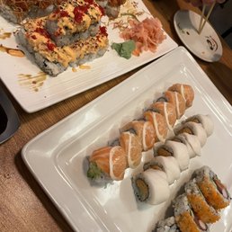 a plate of sushi and a plate of rolls a plate of sushi and a plate of rolls